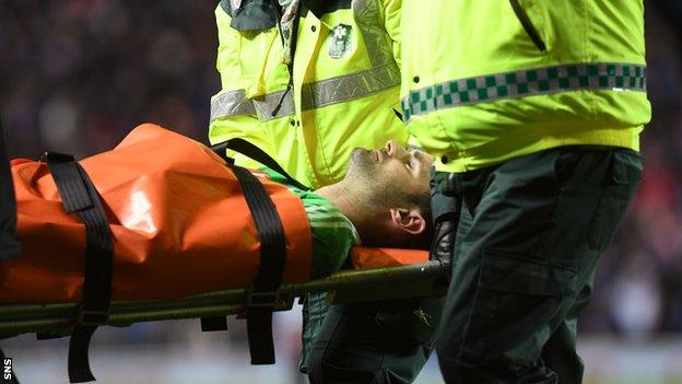 Aberdeen goalkeeper Joe Lewis stretchered off against Rangers