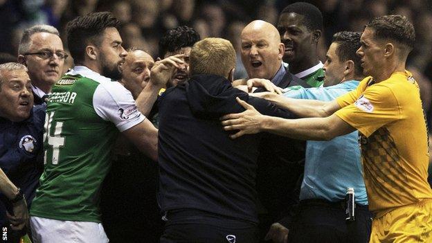 Hibernian manager Neil Lennon (centre) in amongst angry scenes