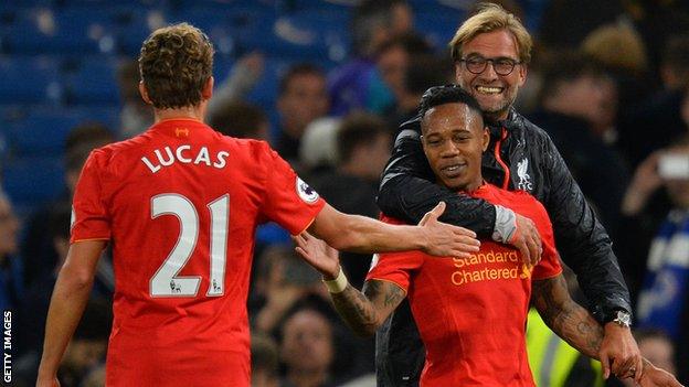 Liverpool manager Jurgen Klopp celebrates with Lucas and Nathaniel Clyne