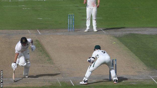 Sussex's Jack Carson being run out