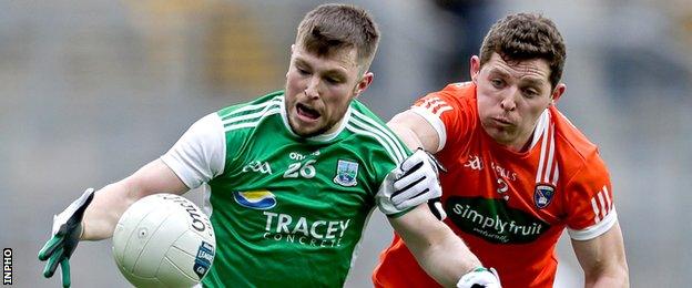 Fermanagh's Daniel Teague battles with Armagh's Patrick Burns in the Football League Division Three final in late March