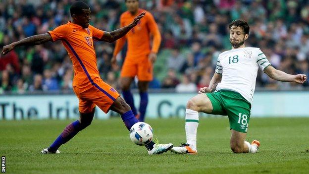 Harry Arter tackles Georginio Wijnaldum at the Aviva Stadium