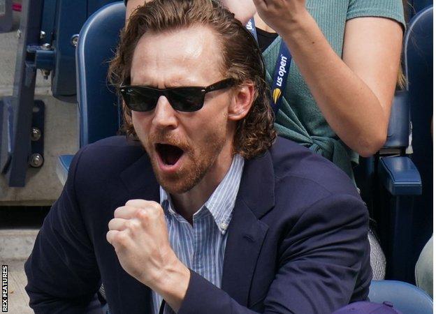 Actor Tom Hiddleston celebrates after Johanna Konta won a point against Karolina Pliskova