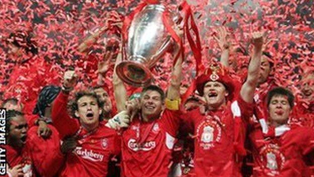 Liverpool players celebrate with the trophy after winning the 2004-05 Champions League final