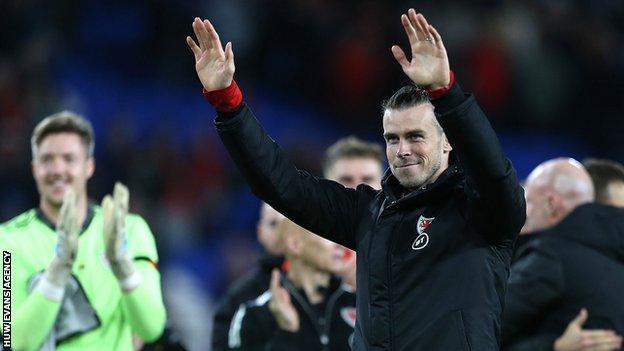 Gareth Bale acknowledges the Wales fans after their win against Belarus