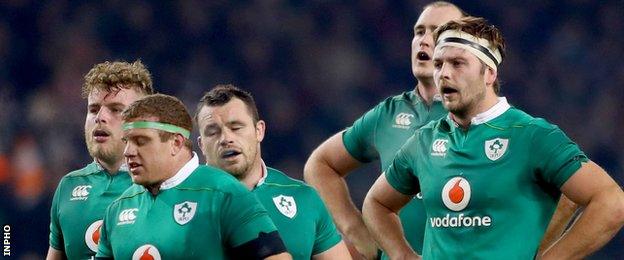 Ireland players show their dejection after their home defeat by New Zealand