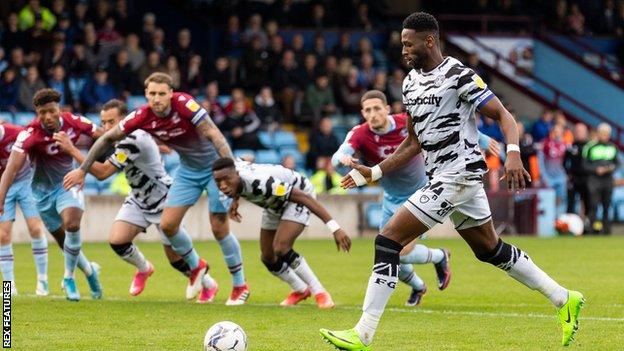 Jamille Matt takes a penalty for Forest Green