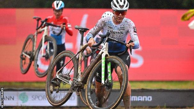 Zoe Backstedt carrying her bike