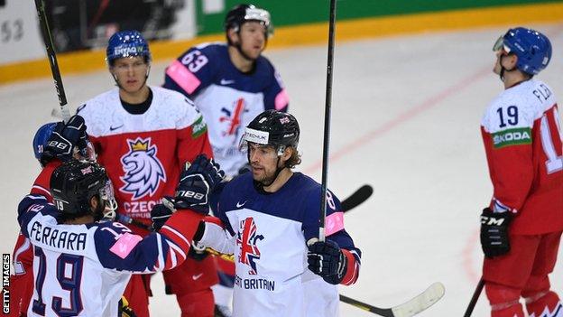 Great Britain's forward Matthew Myers (second right) celebrates his goal with team-mates