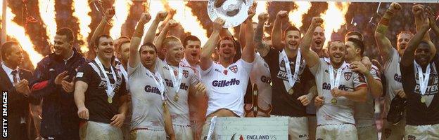 Sean O'Loughlin the captain of England lifts the winners trophy after clinching the series 2-1 during the third International Rugby League Test Series match between England and New Zealand at DW Stadium on November 14, 2015 in Wigan, England.