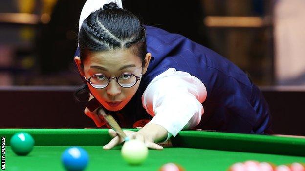 Ng On-yee plays a shot