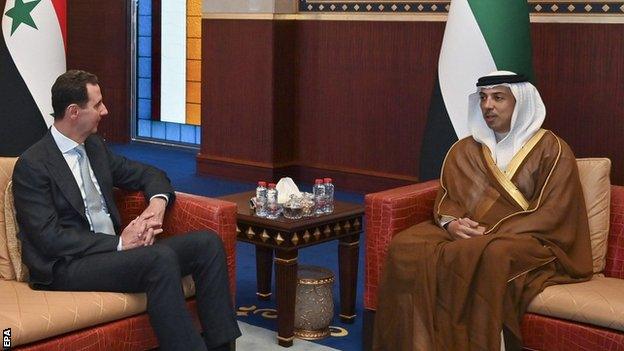 Bashar al-Assad sitting beside Sheikh Mansour bin Zayed Al Nahyan