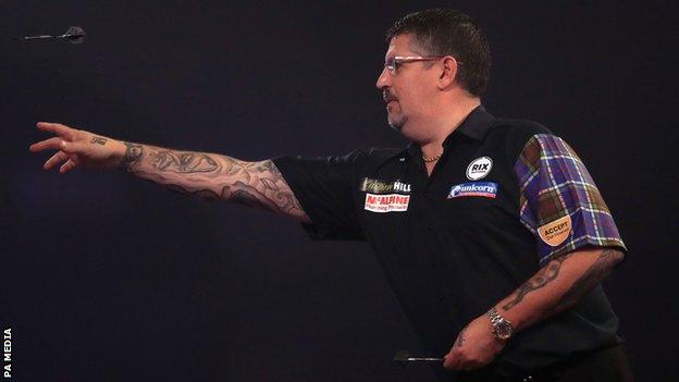 Scotland's Gary Anderson throws a dart during his third-round match against Madars Razma at the PDC World Championship