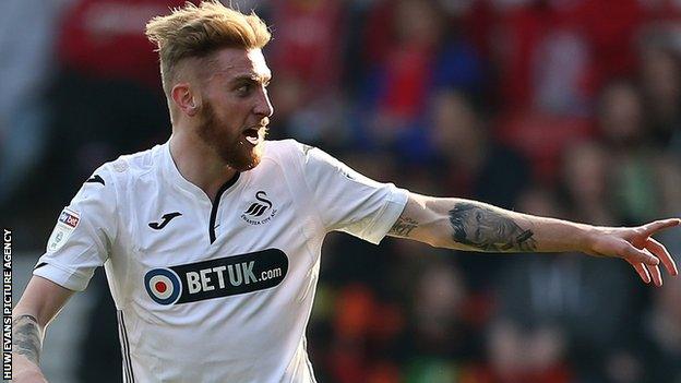 Oli McBurnie celebrates scoring for Swansea City