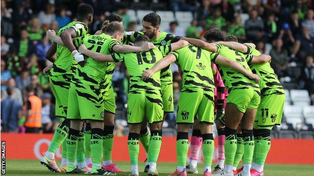 Forest Green Rovers players huddle