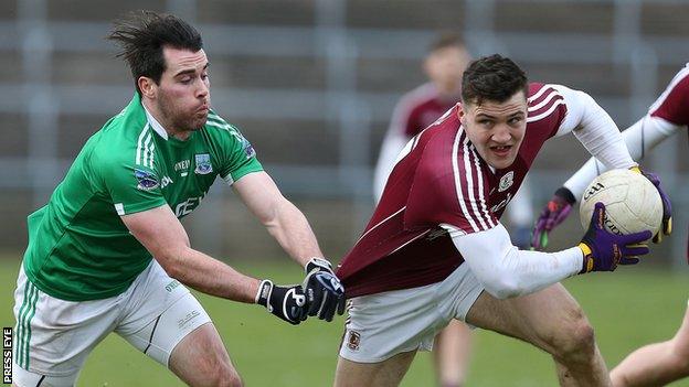 Fermanagh's Barry Mulrone grabs Damien Comer's jersey at Brewster Park