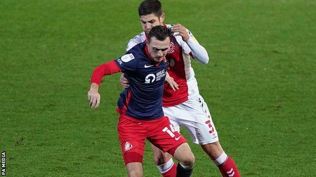 Fleetwood's Charlie Mulgrew and Sunderland's Tom Flanagan (front) tangled in the 1-1 draw at Highbury on 27 November