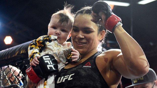 Amanda Nunes celebrated in the octagon with her daughter after beating Megan Anderson