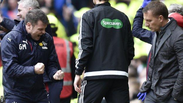 Rangers caretaker Graeme Murty celebrates in front of a disappointed Brendan Rodgers