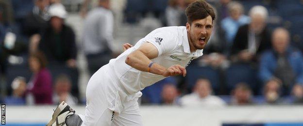 Steven Finn bowls