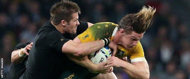 Richie McCaw tackles Michael Hooper in the World Cup final