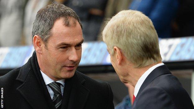 Paul Clement greets Arsene Wenger at Swansea