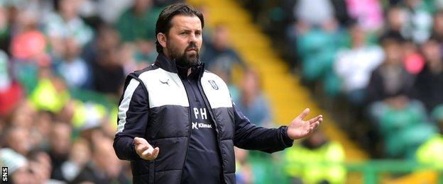 Paul Hartley looks on in horror as his Dundee team leak six goals