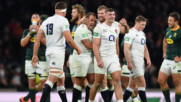 England players celebrate at full time