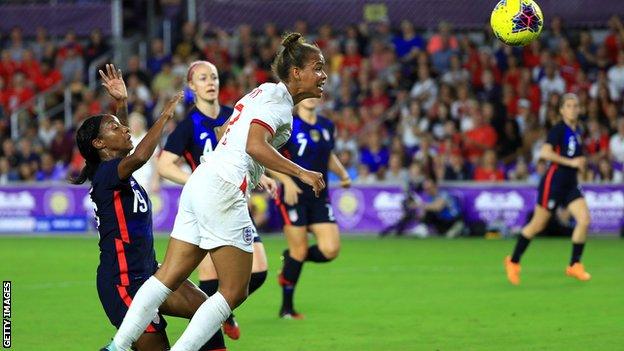 England's Nikita Parris attempts a header