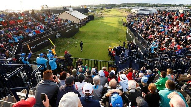 The view from the packed stands as Darren Clarke gets the Open under way on Thursday morning