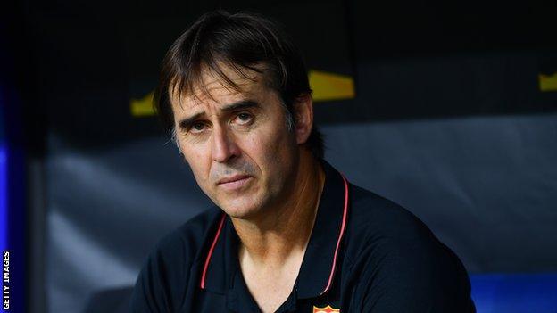 Sevilla boss Julen Lopetegui looks on from the dugout during his side's Europa League quarter-final against Wolves