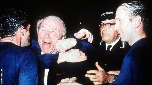 John Aston embraces Matt Busby after United's historic 1968 European Cup Final win, as goal-scorer Sir Bobby Charlton looks on