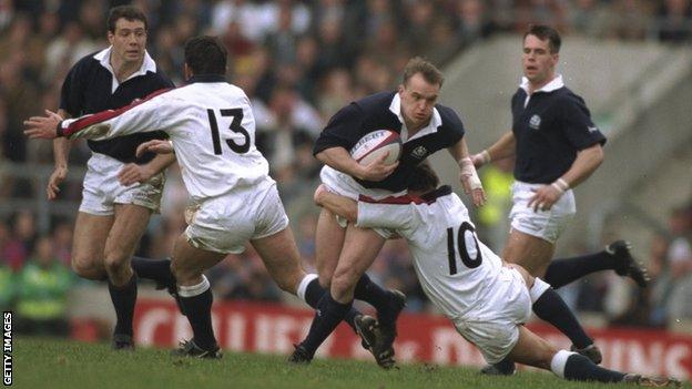 Scotland's Gregor Townsend is tackled by Rob Andrew of England