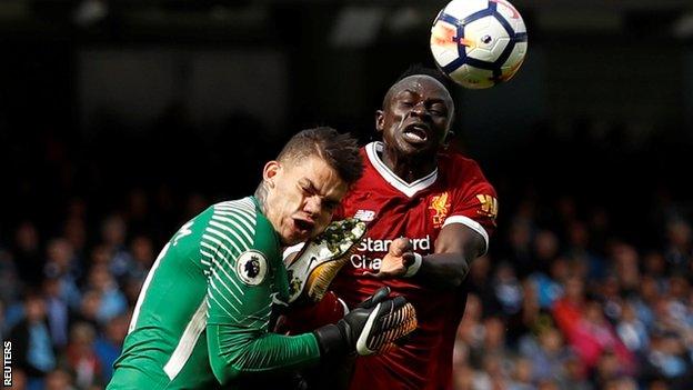 Sadio Mane clashes with Ederson