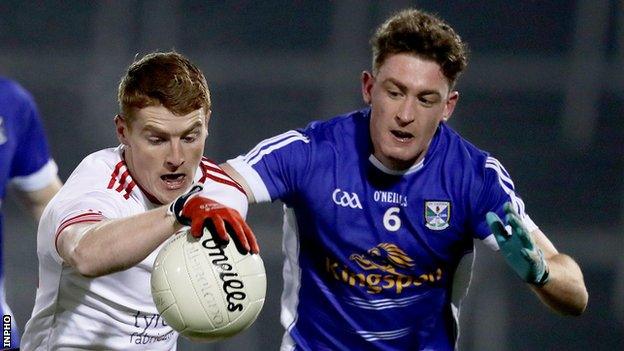 Cavan's Ciaran Brady tries to keep pace with Tyrone's Peter Harte