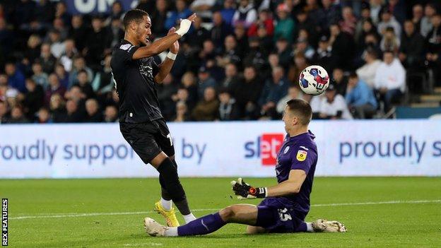 Tom Ince lifts the ball over Steven Benda to score his third goal of the season