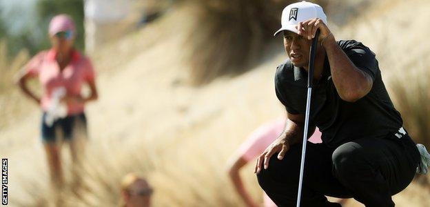 Tiger Woods lines up a putt on the third green during the first round of the Hero World Challenge at Albany, Bahamas in November