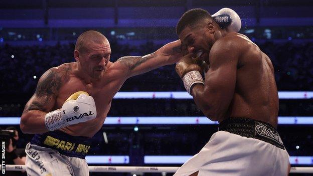 Anthony Joshua is punched by Oleksandr Usyk