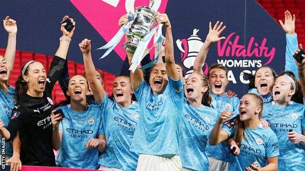 Manchester City captain Steph Houghton lifts the Women's FA Cup after a 3-1 final win over Everton at an empty Wembley in November