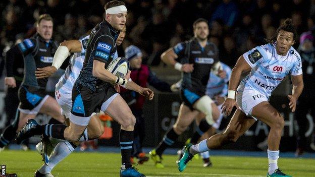 Finn Russell on the attack for Glasgow Warriors against Racing 92