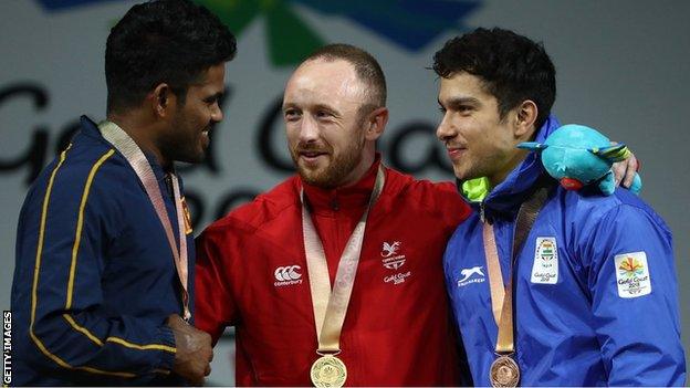 Evans on the podium with Dissanayake Mudiyanselage of Sri Lanka (left) and Lather Deepak of India (right)