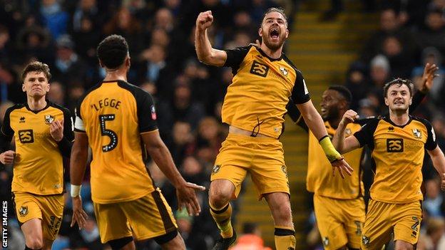 Port Vale's Tom Pope celebrates scoring against Manchester City