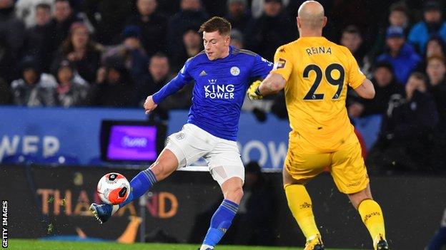 Pepe Reina runs out of his penalty area to try to get to the ball before Harvey Barnes