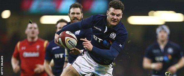 Duncan Taylor on his way to scoring Scotland's second try against Wales