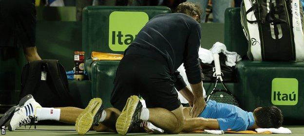 Djokovic gets treatment on his back