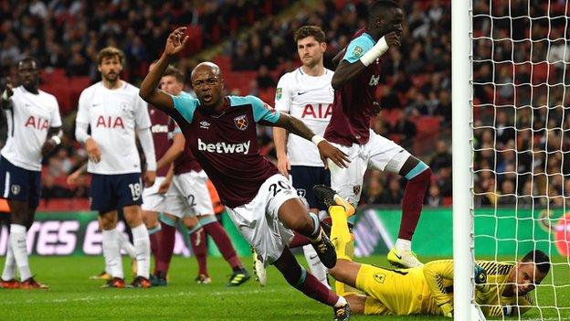 Andre Ayew wheels away after leading West Ham's fight-back against Tottenham on Wednesday