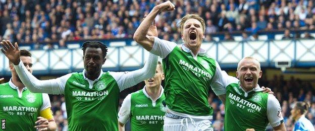 Hibs players celebrate at Ibrox after beating Rangers