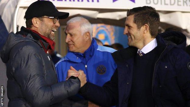 Liverpool manager Jurgen Klopp and Sam Ricketts shake hands