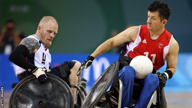 Mark Zurpan of the USA (L) rams into Alan Ash of Great Britain (R) as they compete in the Wheelchair Rugby match between USA and Great Britain at Beijing