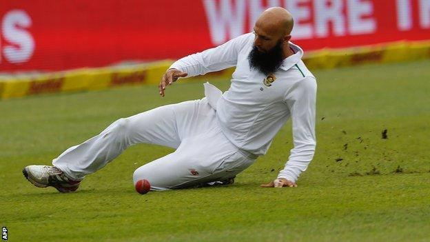 Hashim Amla slides in the field